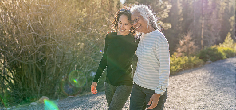 two women walking in a park